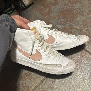 pink and white Nike blazers